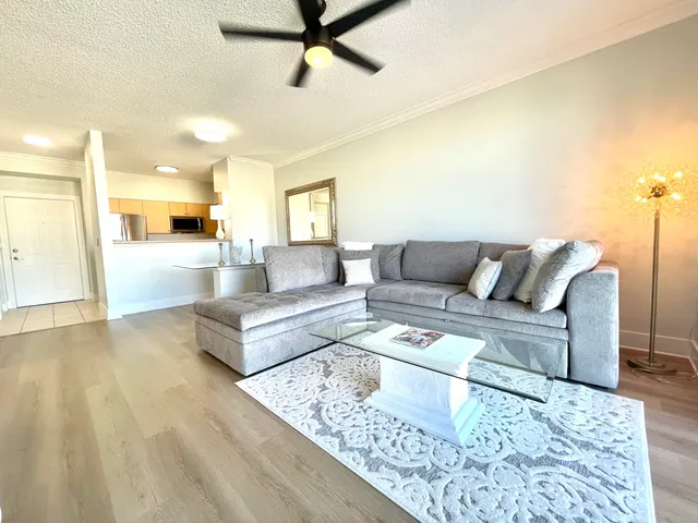 a living room with furniture and a rug