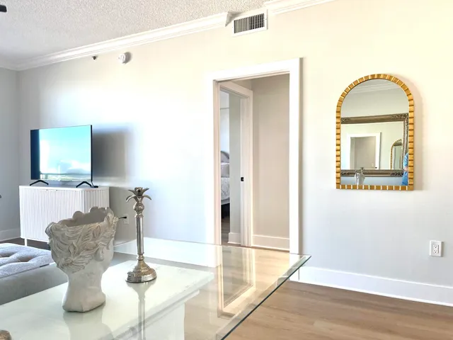 a dining room with wooden floor and dining table