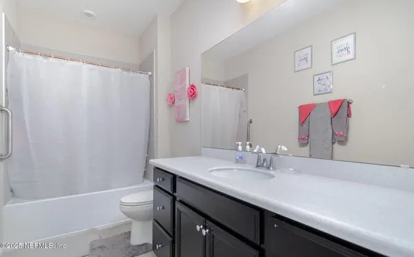 a bathroom with a sink a toilet and a bathtub