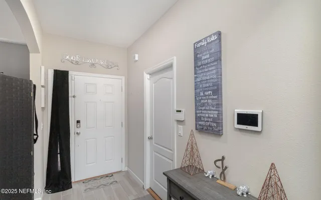 a view of a livingroom with furniture and front door