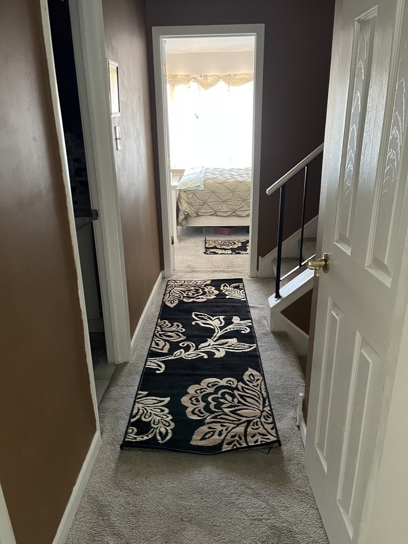 18650 Golfview Drive Hazel Crest, IL 60429 - Photo 19 of 35 a bed sitting in a balcony next to a window