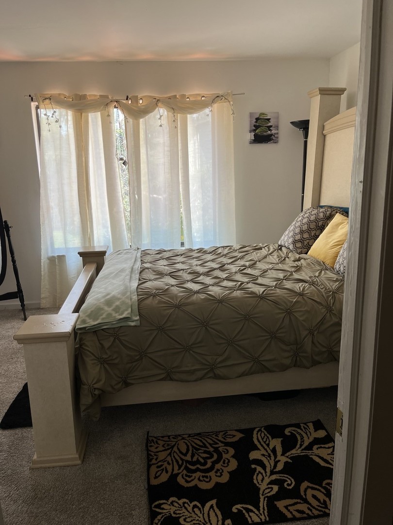 18650 Golfview Drive Hazel Crest, IL 60429 - Photo 20 of 35 a bedroom with a bed and a window