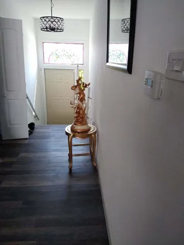 a view of entryway with wooden floor