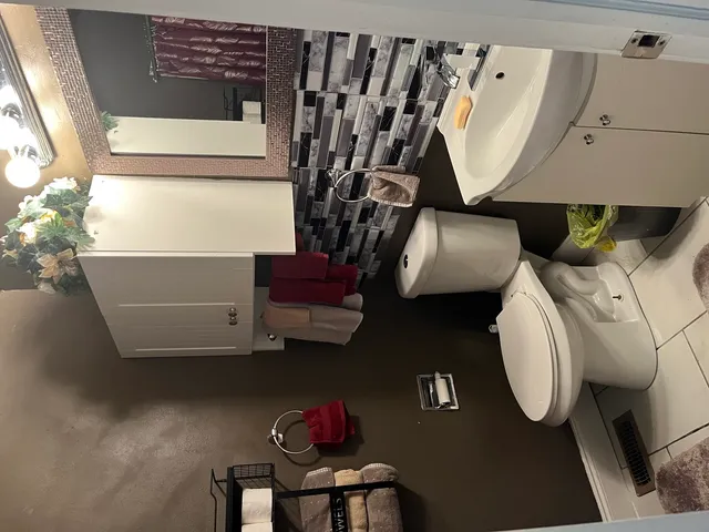 a bathroom with a sink and mirror