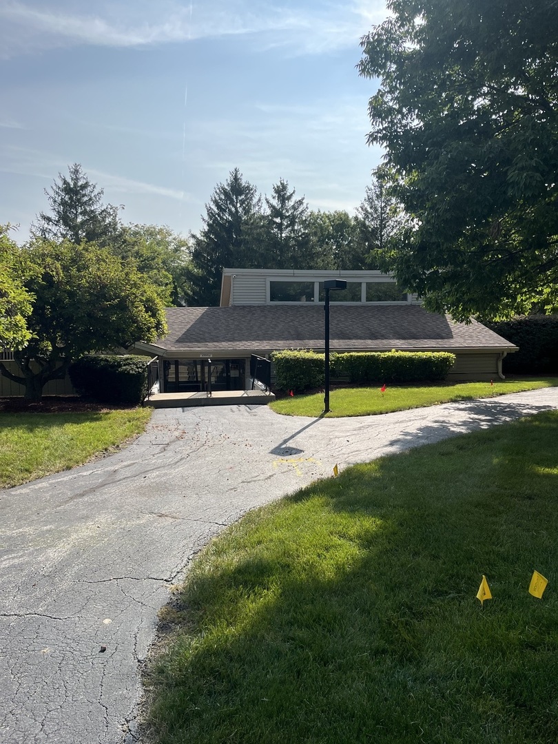 18650 Golfview Drive Hazel Crest, IL 60429 - Photo 9 of 35 a view of a swimming pool with a yard and palm trees