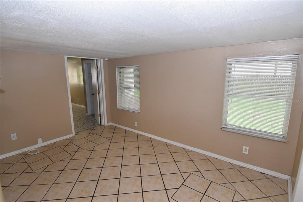 7524 Galahad Road Port Richey, FL 34668 - Photo 12 of 26 a view of an empty room and window