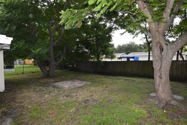 a view of a house with a tree