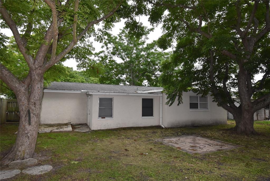 7524 Galahad Road Port Richey, FL 34668 - Photo 16 of 26 a view of a house with a tree