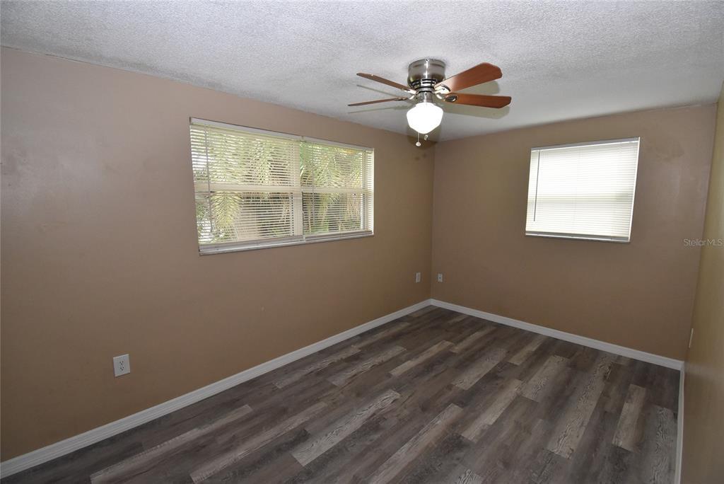 7524 Galahad Road Port Richey, FL 34668 - Photo 19 of 26 a view of room with window and ceiling fan