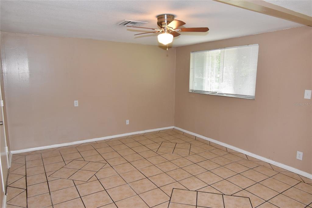 7524 Galahad Road Port Richey, FL 34668 - Photo 4 of 26 a view of an empty room and window