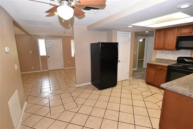 a view of a livingroom and an empty room