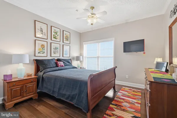 a bedroom with a bed and a tv