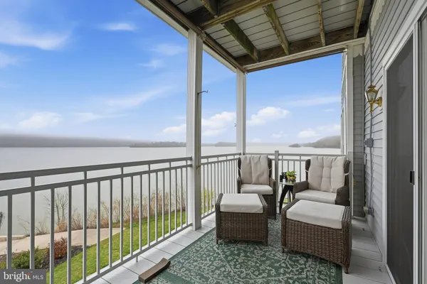 a balcony with chairs