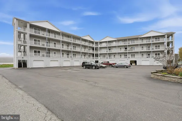 a building with cars parked in front of it