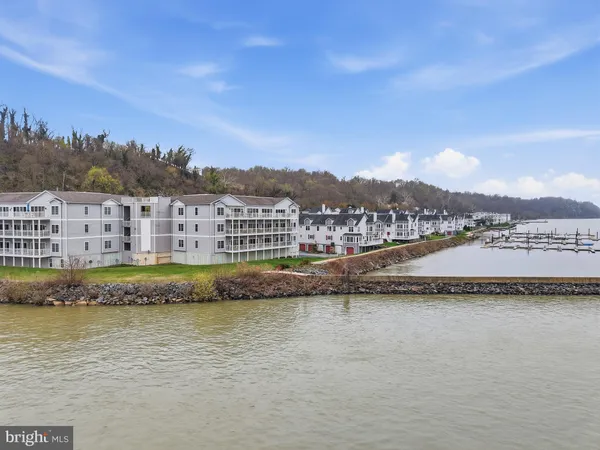 an aerial view of a house with outdoor space