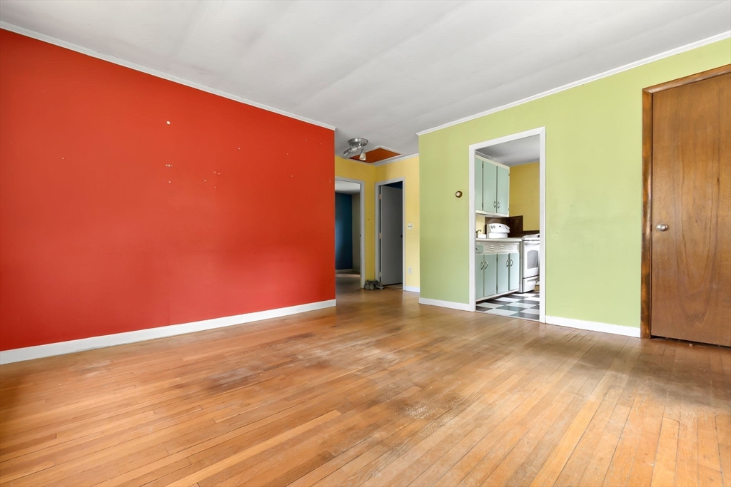 71 Union Street Hamilton, MA 01982 - Photo 5 of 21 an empty room with wooden floor and closet