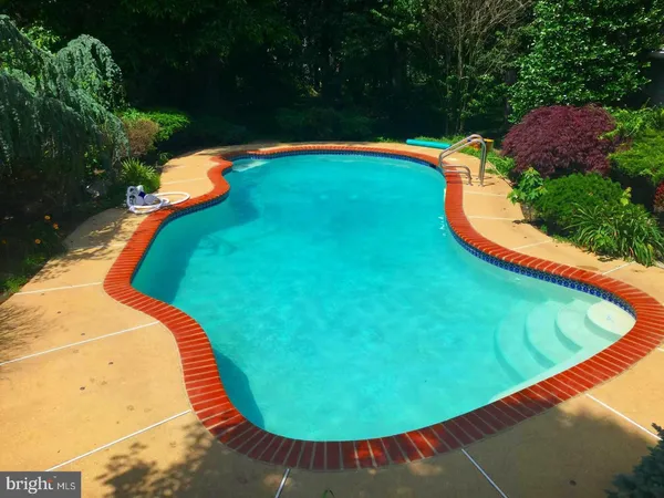 an aerial view of a swimming pool