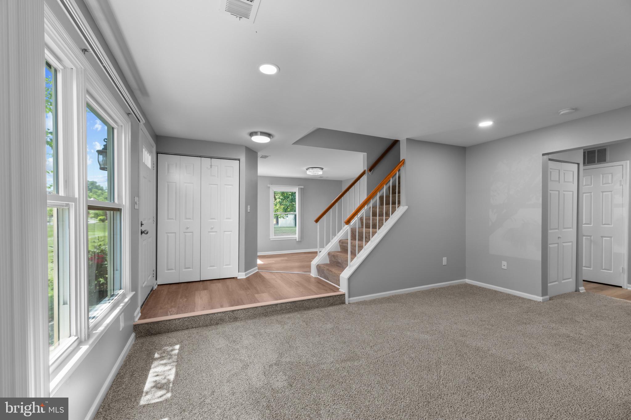 9302 Player Drive, Unit 155 Laurel, MD 20708 - Photo 6 of 43 a view of an empty room with stairs