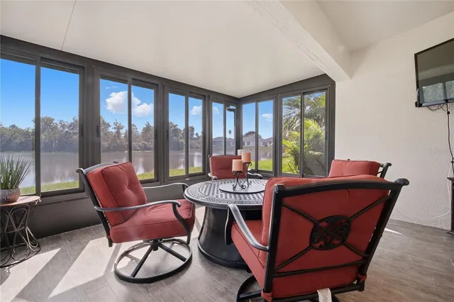 a bedroom with a bed and a flat tv screen