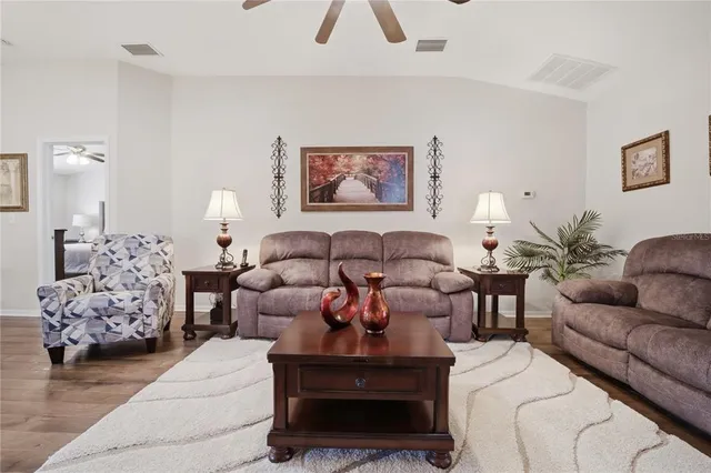 a bedroom with furniture and a flat screen tv