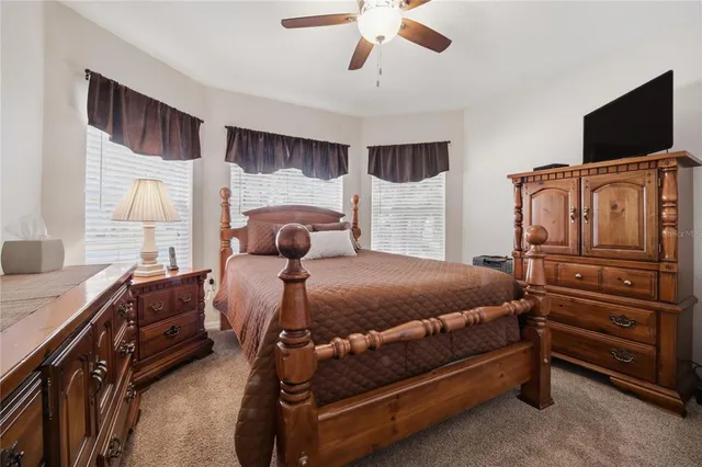 an aerial view of a house with a garden and lake view