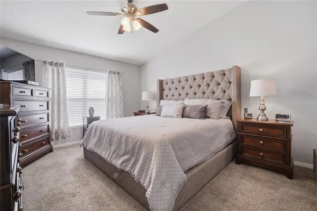 a view of a patio with table and chairs potted plants with wooden fence