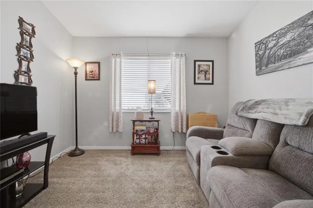 a sign that is sitting in front of flowers