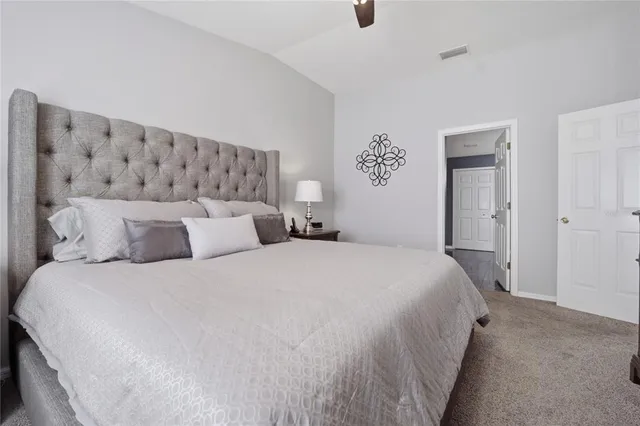 an aerial view of residential houses with outdoor space and swimming pool