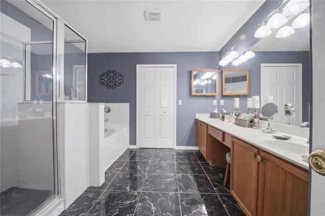 a view of a house with a backyard patio and swimming pool