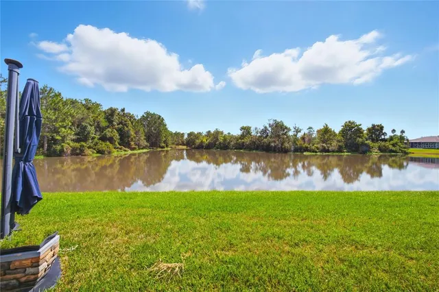 a view of a lounge chair in the backyard of the house