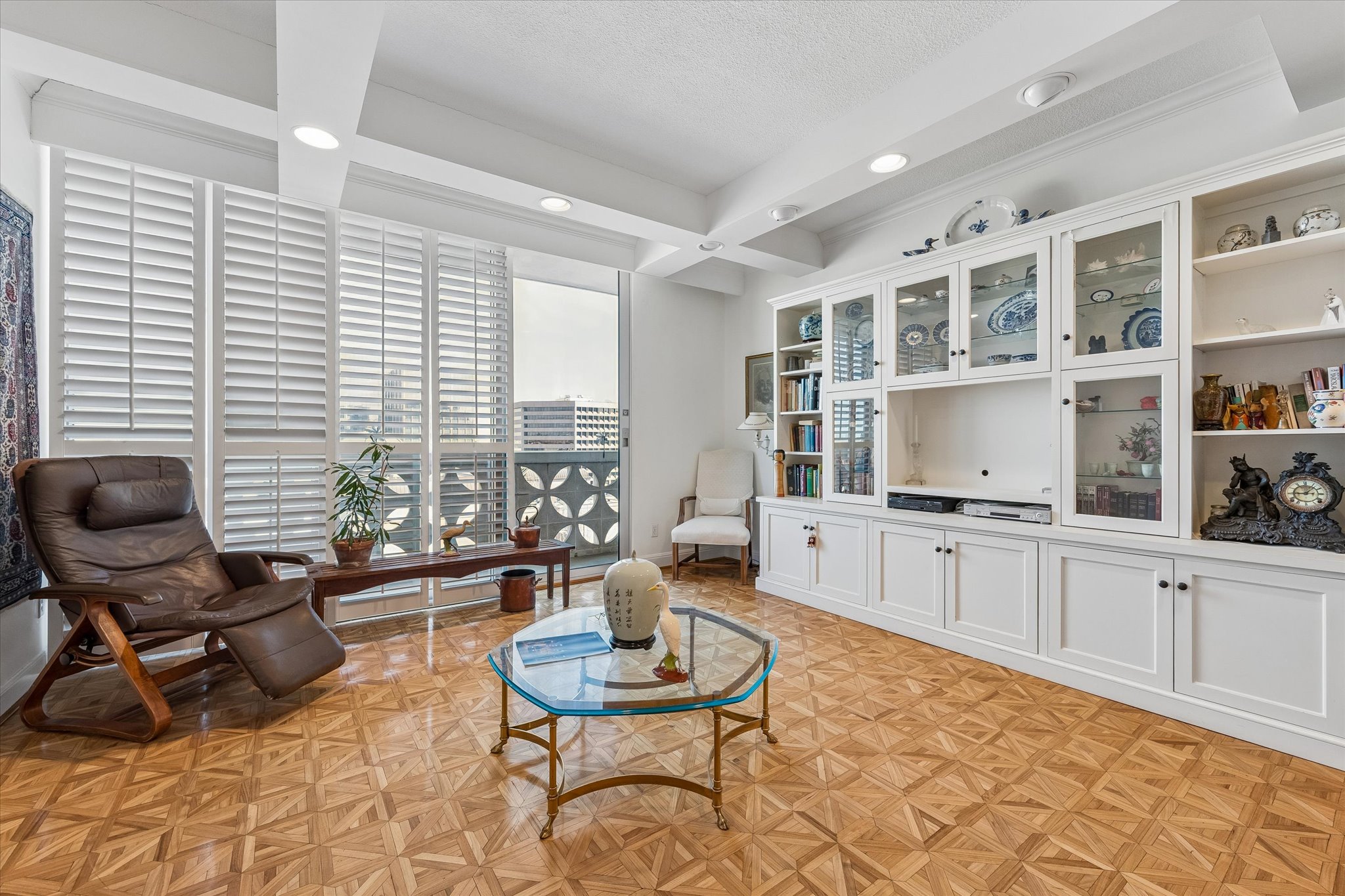 1801 Lavaca Street, Unit 6E Austin, TX 78701 - Photo 2 of 32 Sitting room with real parquet flooring, coffered ceiling, recessed lighting, and a textured ceiling