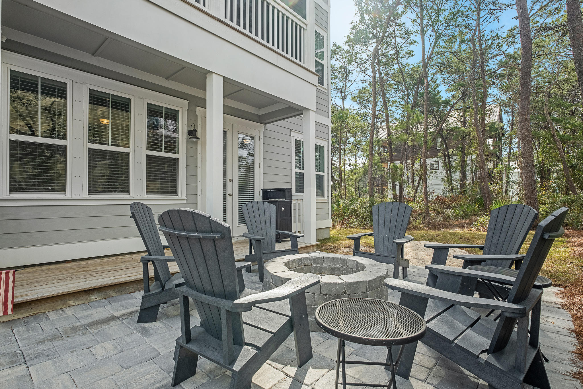 91 Grande Pointe Circle Inlet Beach, FL 32461 - Photo 9 of 49 a view of a patio with table and chairs and potted plants