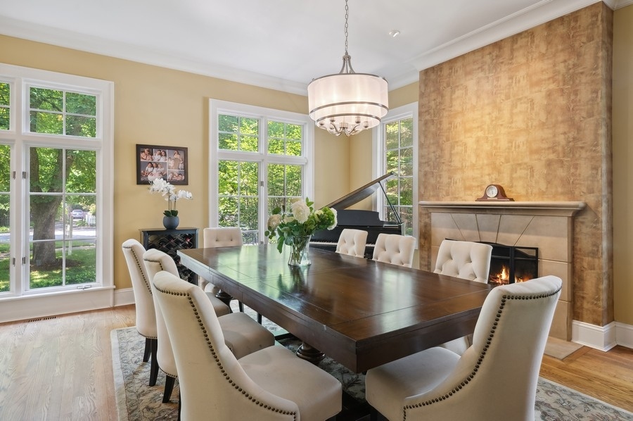 501 Ridge Road Kenilworth, IL 60043 - Photo 15 of 46 a dining room with furniture a chandelier and wooden floor