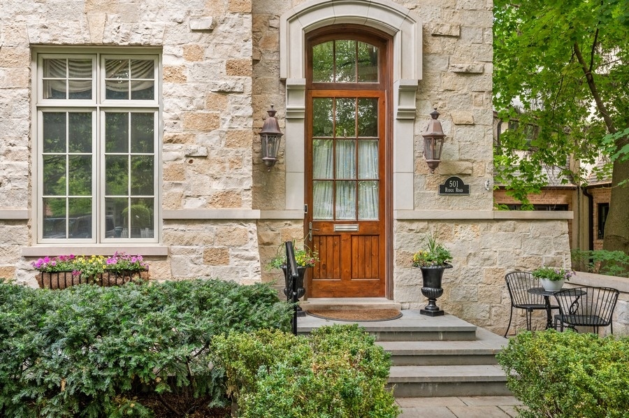 501 Ridge Road Kenilworth, IL 60043 - Photo 2 of 46 a front view of a house with a garden