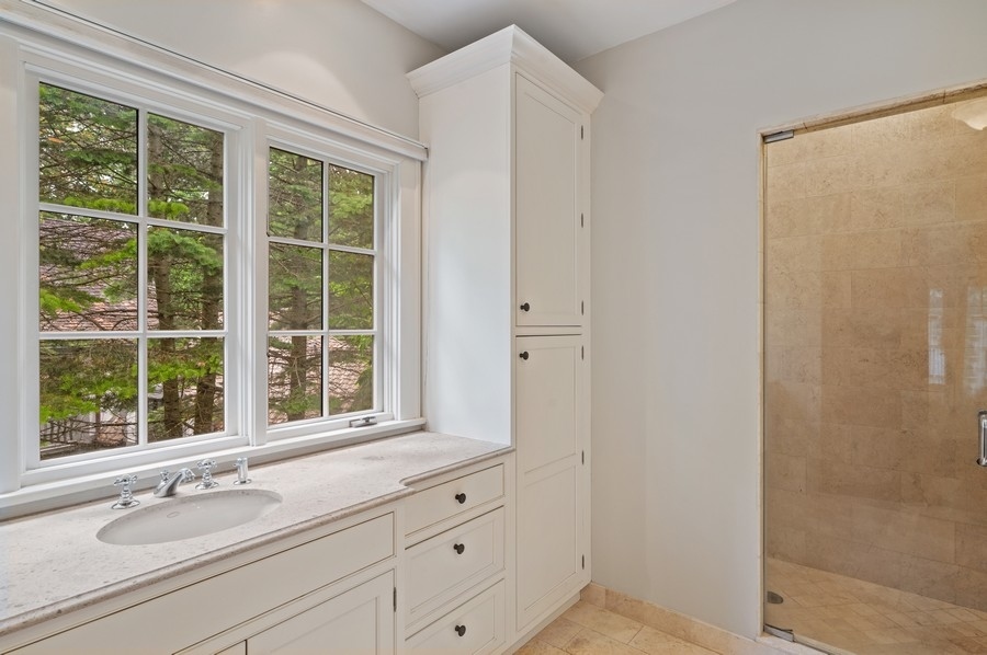 501 Ridge Road Kenilworth, IL 60043 - Photo 22 of 46 a bathroom with a sink and a window