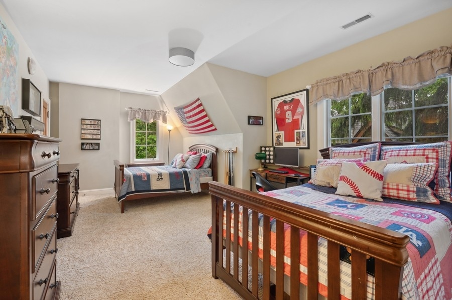 501 Ridge Road Kenilworth, IL 60043 - Photo 24 of 46 a bedroom with furniture and a window