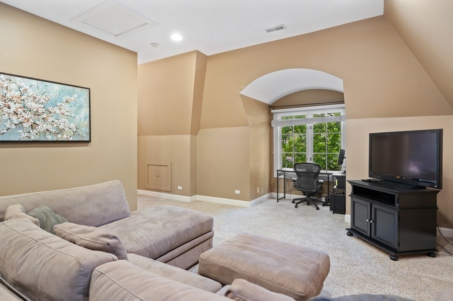 501 Ridge Road Kenilworth, IL 60043 - Photo 28 of 46 a living room with furniture and a flat screen tv