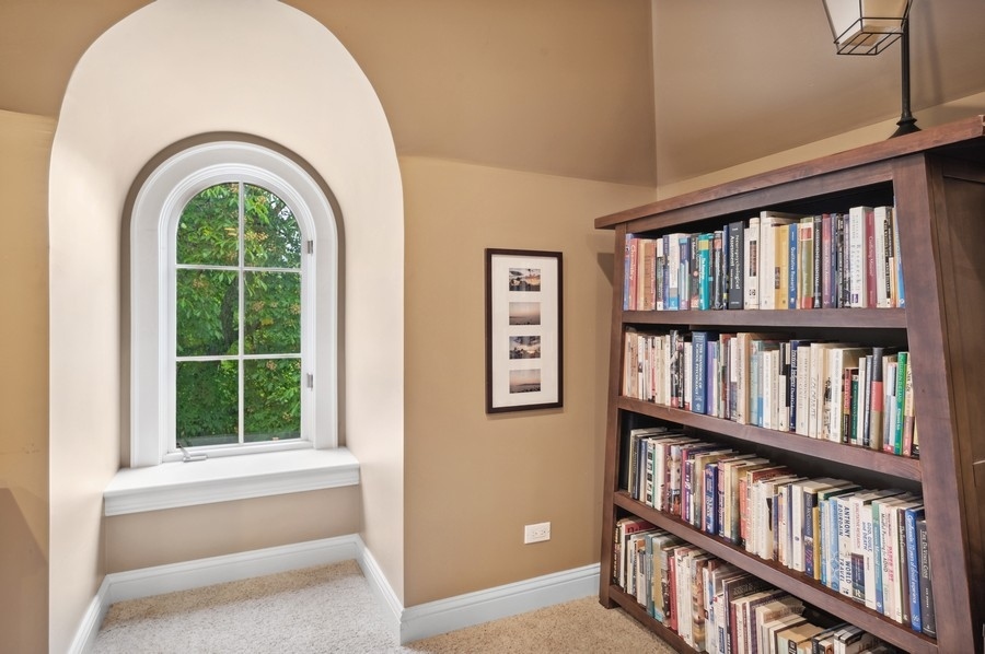 501 Ridge Road Kenilworth, IL 60043 - Photo 29 of 46 a living room with furniture and a book shelf