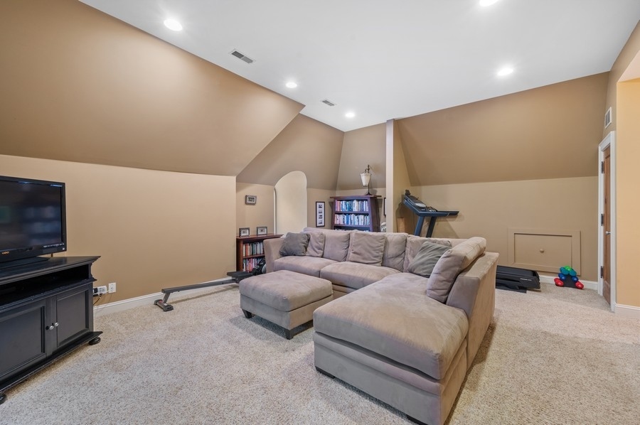 501 Ridge Road Kenilworth, IL 60043 - Photo 30 of 46 a living room with furniture and a flat screen tv