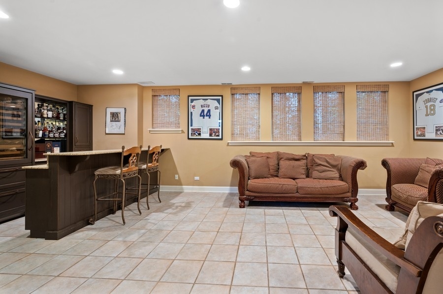501 Ridge Road Kenilworth, IL 60043 - Photo 32 of 46 a living room with furniture and a flat screen tv
