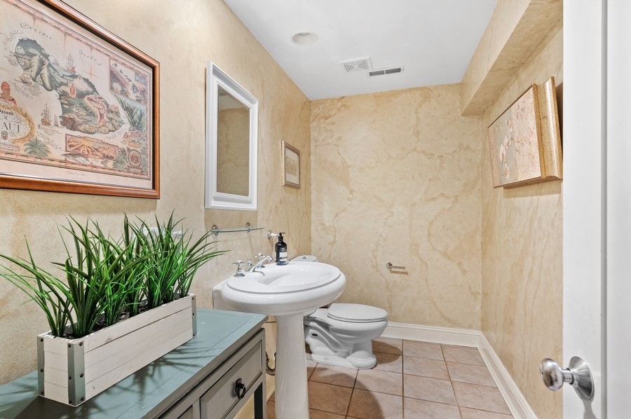 501 Ridge Road Kenilworth, IL 60043 - Photo 35 of 46 a bathroom with a sink and a mirror