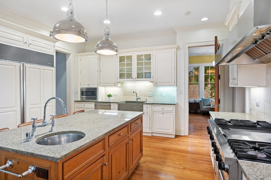 501 Ridge Road Kenilworth, IL 60043 - Photo 5 of 46 a kitchen with stainless steel appliances granite countertop a sink stove and refrigerator