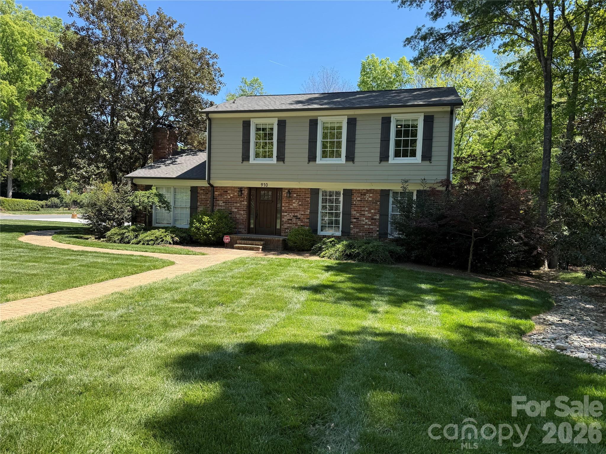 910 Braeburn Road Charlotte, NC 28211 - Photo 1 of 1 a front view of a house with a yard