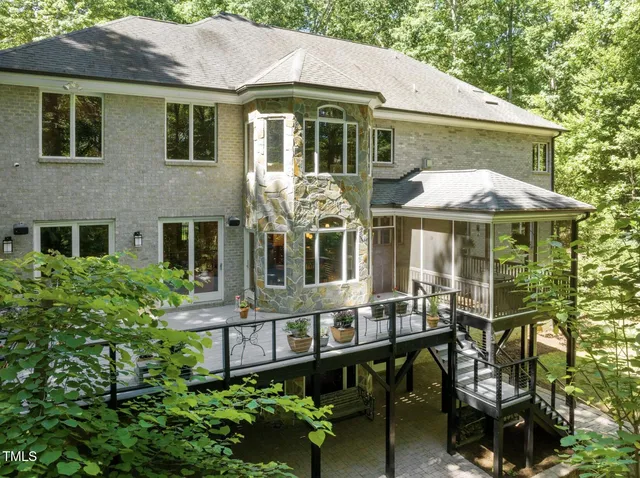 a living room with furniture tv and a window