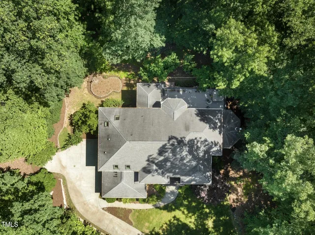 a view of a hallway with entryway wooden floor and windows
