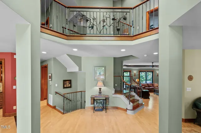 a view of hallway with wooden floor