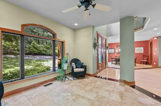 a spacious bedroom with a bed and a window