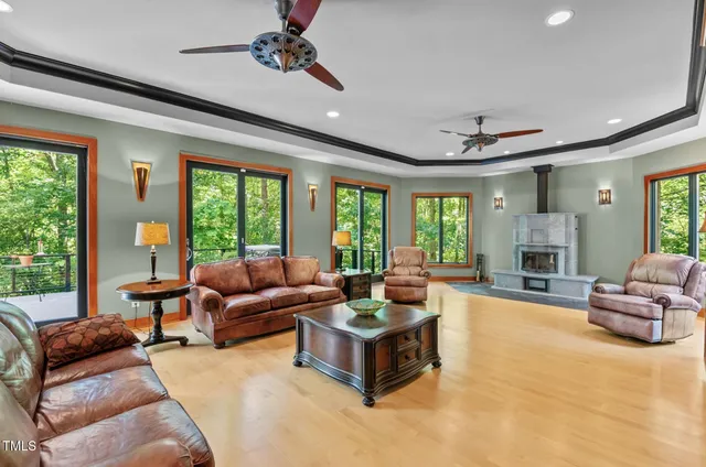 a room with pool table and windows
