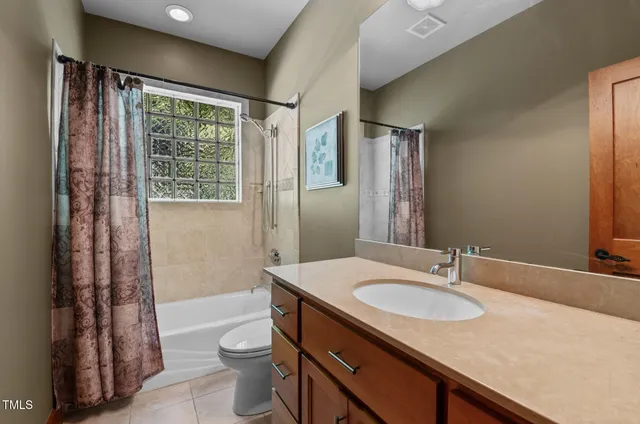 a bathroom with a shower and a toilet