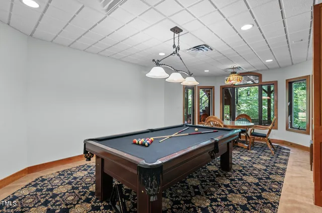 a bath tub sitting in a bathroom next to a window